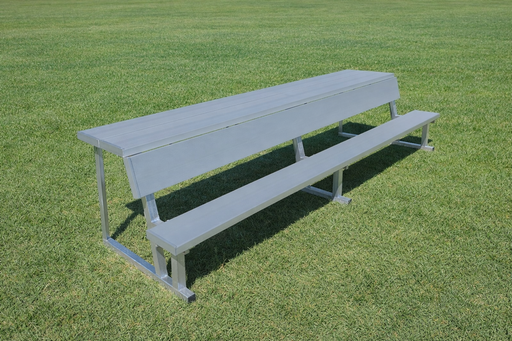 Gray bench on a grassy field