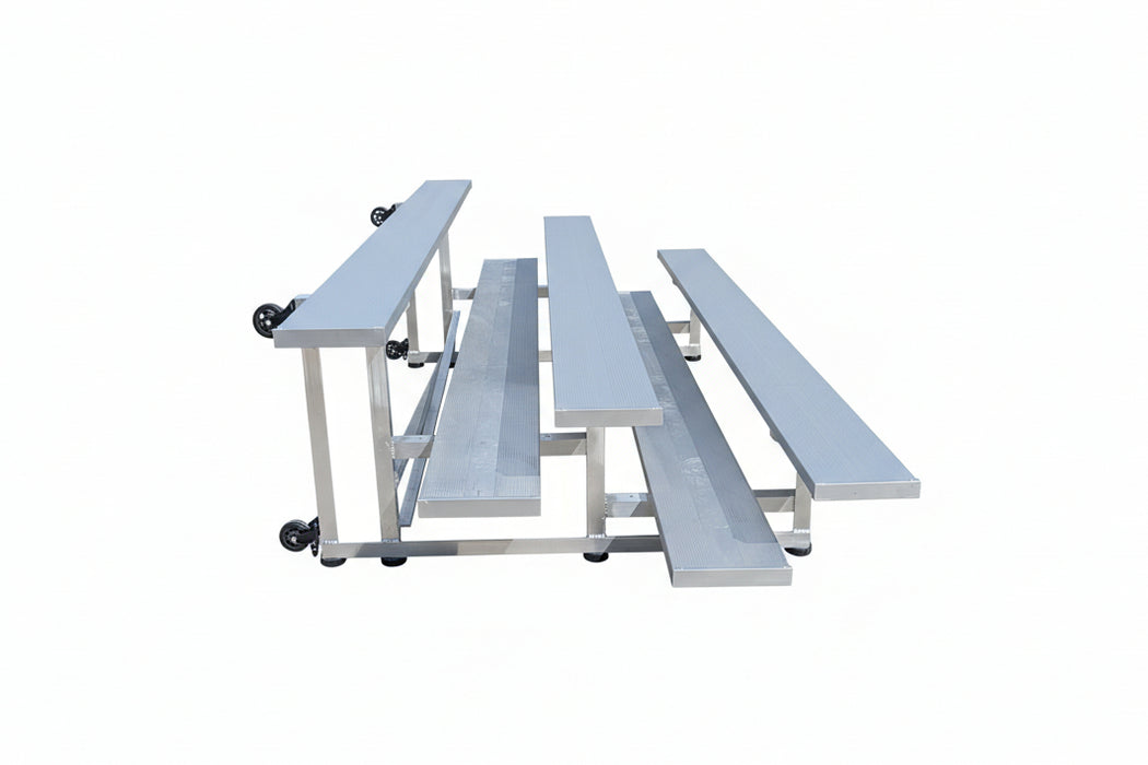 Metal bleachers on a concrete surface with trucks in the background