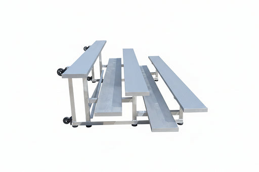 Metal bleachers on a concrete surface with trucks in the background