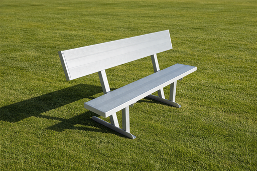 White bench on a grassy field